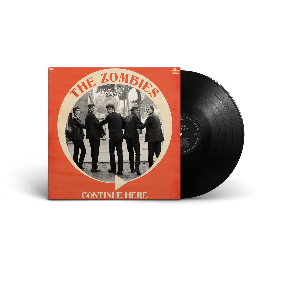 Vinyl record album for 'Continue Here' by The Zombies, featuring a red-orange sleeve with a vintage black-and-white band photo and a partially pulled black vinyl record,